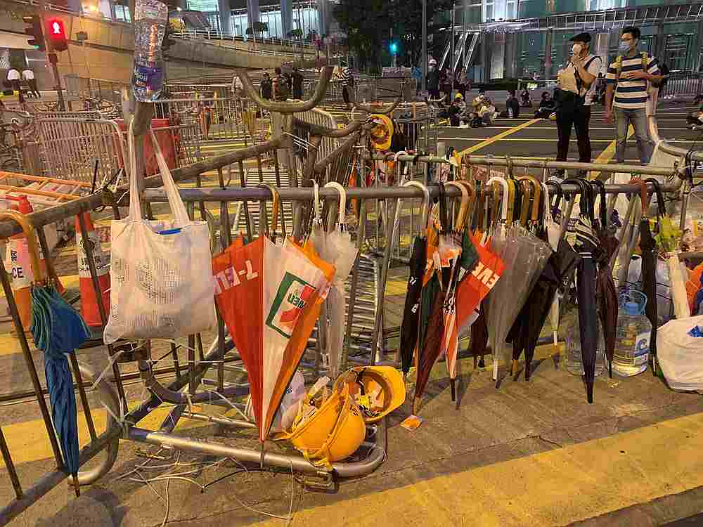 Umbrellas hang off a barricade during a demonstration against a proposed extradition bill in Hong Kong June 12, 2019. u00e2u20acu201d Twitter@HongKongHermit image via Reuters