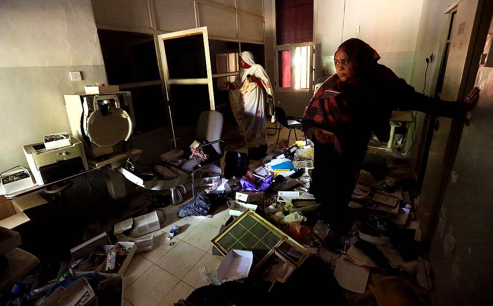 Workers walk through the equipment vandalised during the crackdown on protesters, inside the eye hospital in Omdurman, Khartoum, Sudan June 10, 2019. u00e2u20acu201d Reuters pic