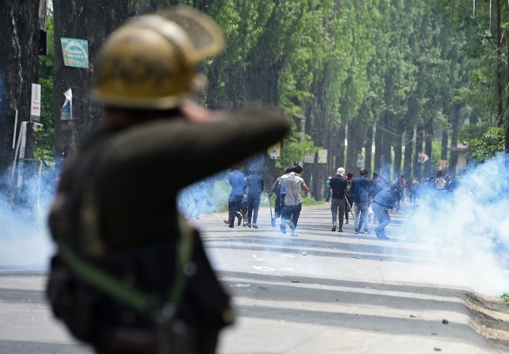 Indian police fire tear smoke shells towards Kashmiri protestors at Mirgund Pattan on the outskirts of Srinagar on May 13, 2019, as protesters called for justice in the case of the alleged rape of a three-year-old girl. u00e2u20acu201d AFP pic