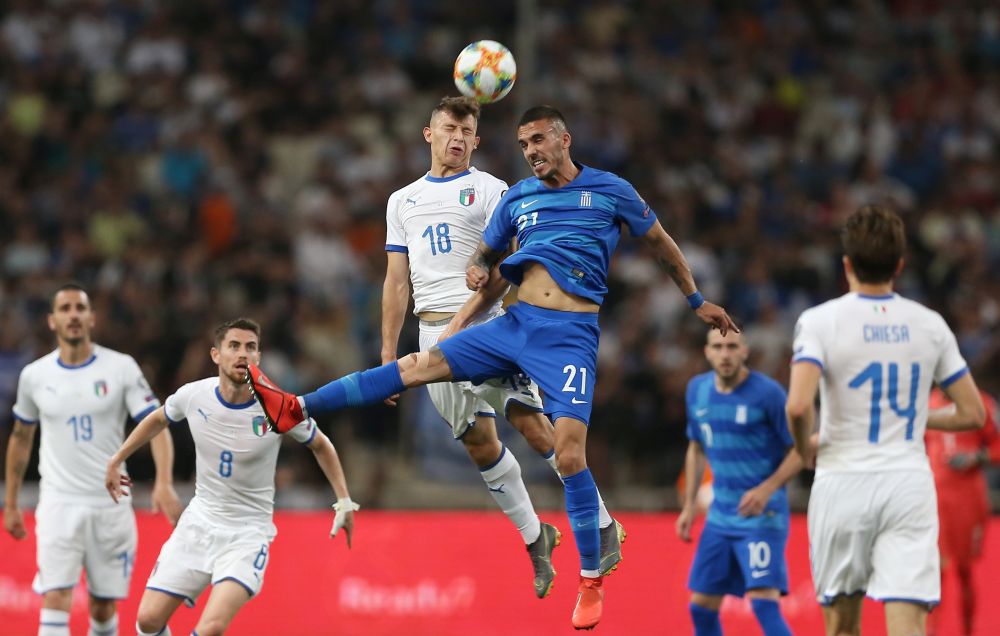 Italy's Nicolo Barella (18) in action with Greece's Dimitrios Kourbelis. u00e2u20acu201d Reuters pic 