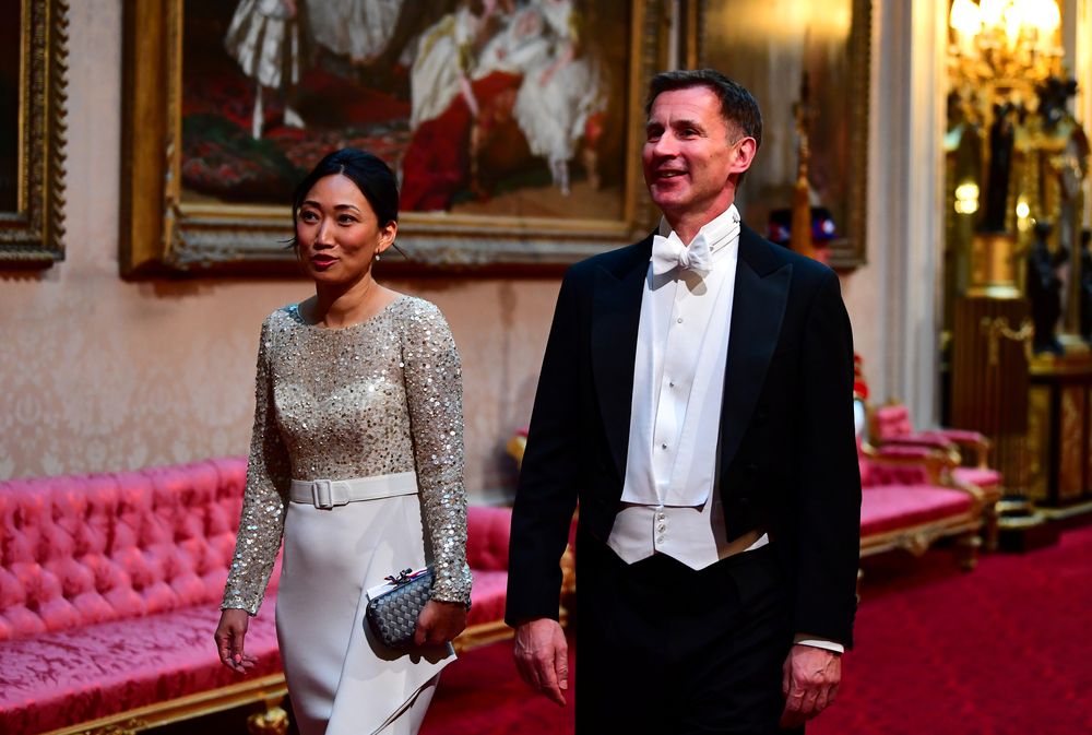 Foreign Secretary Jeremy Hunt and his wife Lucia arrive at the State Banquet for US President Donald Trump and his wife Melania Trump at Buckingham Palace in London, Britain June 3, 2019. u00e2u20acu201d Victoria Jones/Pool via Reuters