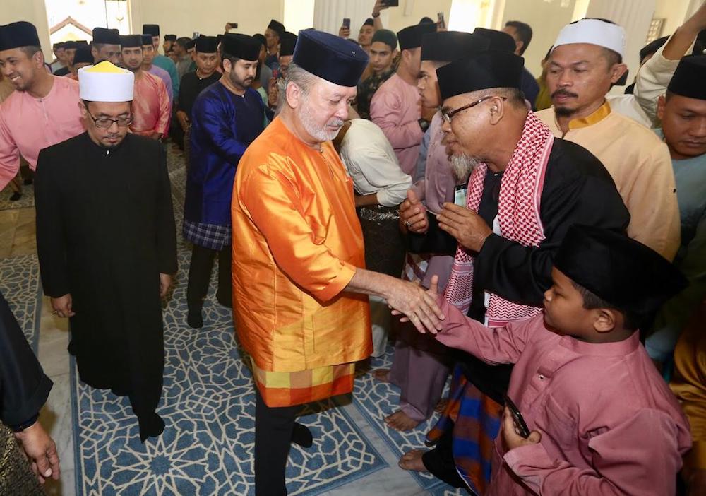 Johor ruler Sultan Ibrahim Sultan Iskandar shakes hands with the public after Aidilfitri prayers at Abu Bakar Mosque in Johor Baru June 5, 2019. — Picture courtesy of Johor Royal Press Office
