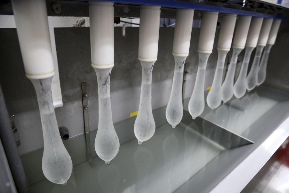 The electrolyte test check the condoms for any pinholes, defects or flaws using water and electricity. ― Picture by Yusof Mat Isa