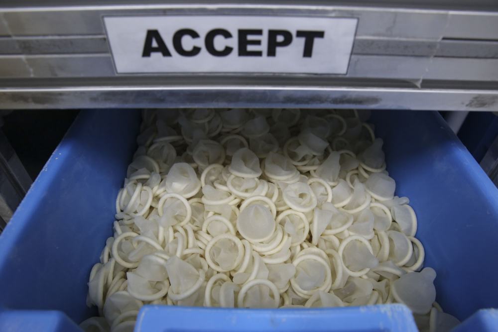 The condoms that pass the final test end up in the ‘accepted’ bucket. ― Picture by Yusof Mat Isa