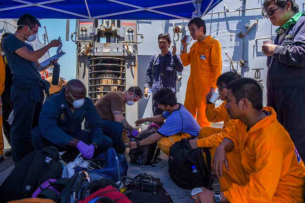 Crew members of the Kokuka Courageous oil tanker receive medical attention from military personnel aboard missile destroyer USS Bainbridge, at sea June 13, 2019. u00e2u20acu201d US Navy/Mass Communication Specialist 3rd Class Jason Waite pic via Reuters