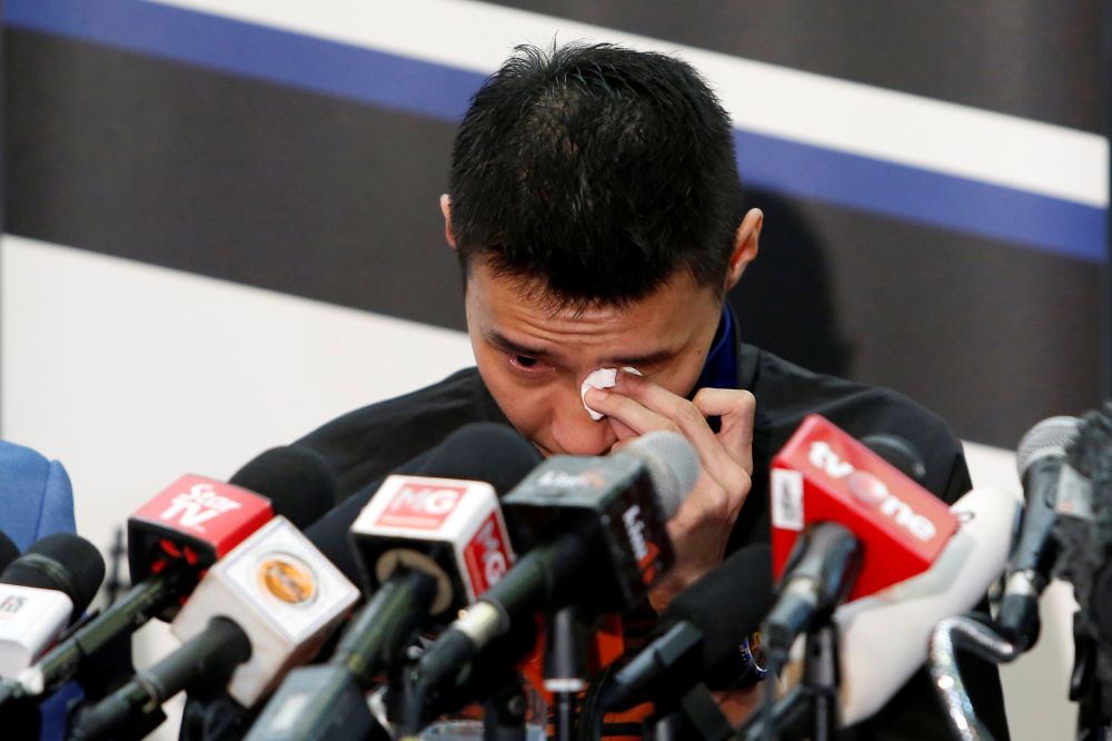 Datuk Lee Chong Wei wipes away tears during a news conference to announce his retirement in Putrajaya June 13, 2019. u00e2u20acu201d Reuters pic
