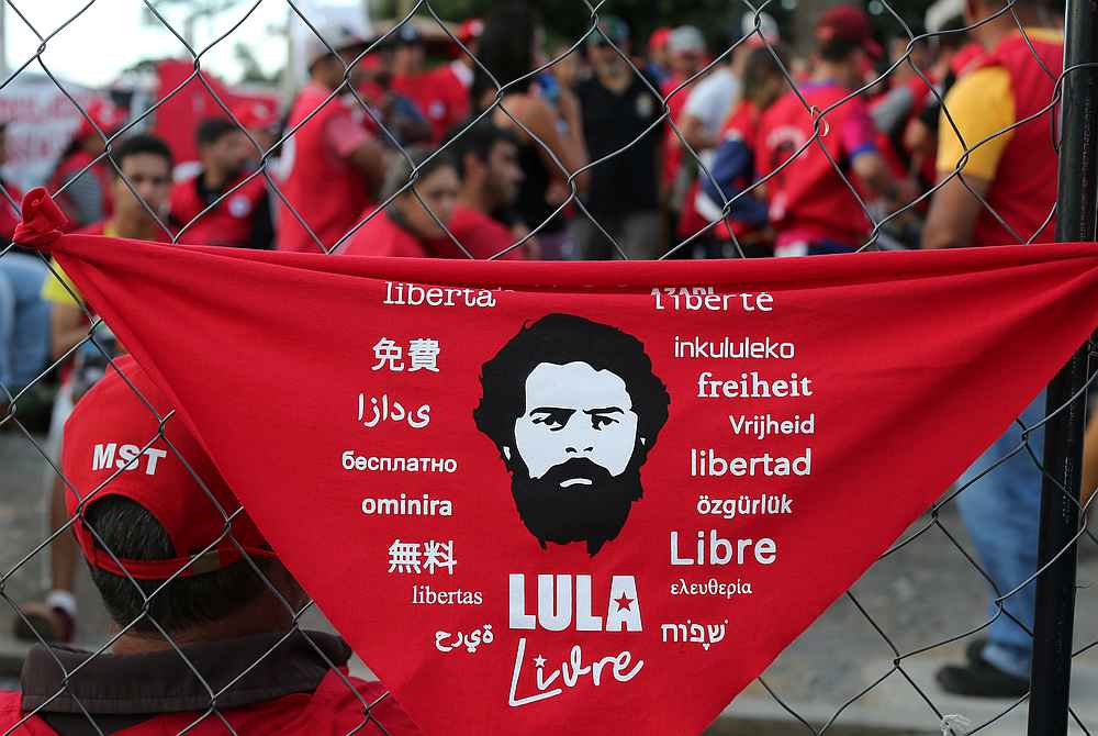 Former Brazilian President Luiz Inacio Lula da Silva's supporters gather outside the Federal Police headquarters in Curitiba, Brazil June 25, 2019. The sign reads: 'Free Lula.' u00e2u20acu201d Reuters pic