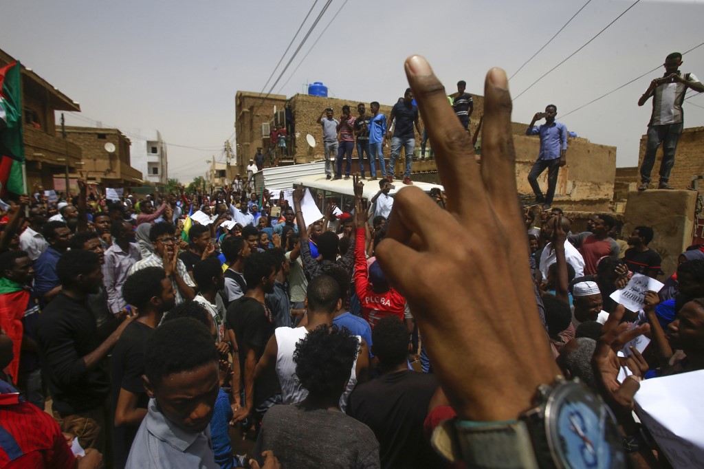 A Sudanese protester flashes the V sign during a mass demonstration against Sudanu00e2u20acu2122s ruling generals in Khartoum on June 30, 2019. Police fired tear gas at protesters in Khartoum as thousands gathered for a mass demonstration. u00e2u20acu201d AFP pic