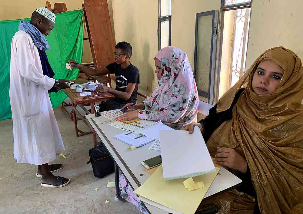 A man attends voting at a polling station during presidential election in Nouakchott, Mauritania June 22, 2019. u00e2u20acu201d Reuters pic