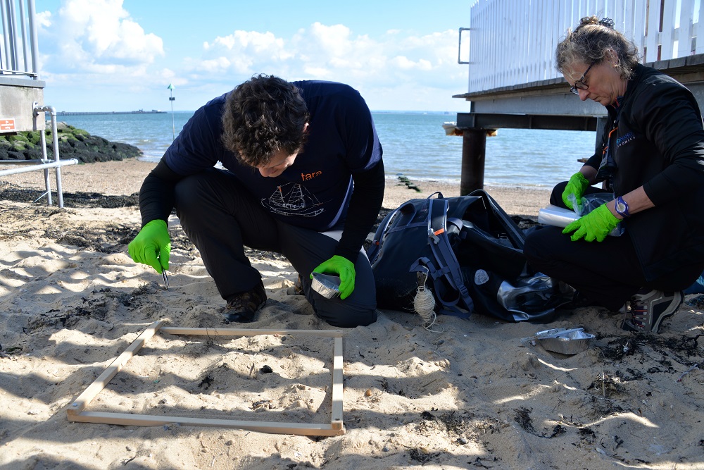 Researchers Valerie Barbe (right) and Boris Eyheraguibel, members of Tarau00e2u20acu2122s microplastics expedition, look for plastics in the sand on Southend-at-sea beach near London June 11, 2019. u00e2u20acu201d AFP pic          
