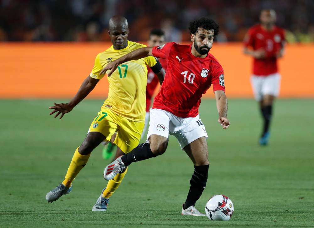 Egypt's Mohamed Salah in action with Zimbabwe's Knowledge Musona during the Africa Cup of Nations  match in Cairo June 21, 2019. u00e2u20acu2022 Reuterspic