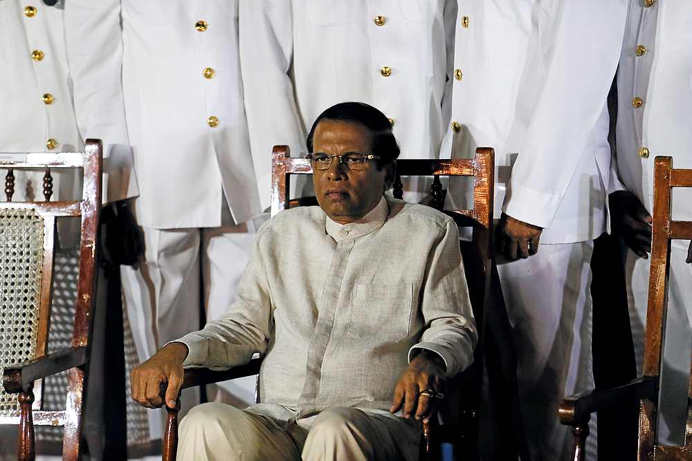 Sri Lanka's President Maithripala Sirisena waits next to Navy officers for a group photo at the main port in Colombo, Sri Lanka June 6, 2019. u00e2u20acu201d Reuters pic