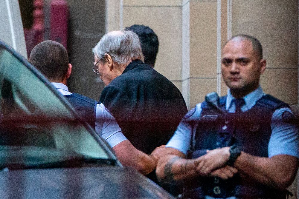 Jailed Australian Cardinal George Pell (centre) is escorted to a white van as he leaves Victoria Stateu00e2u20acu2122s Supreme Court in Melbourne on June 6, 2019. u00e2u20acu201d AFP pic