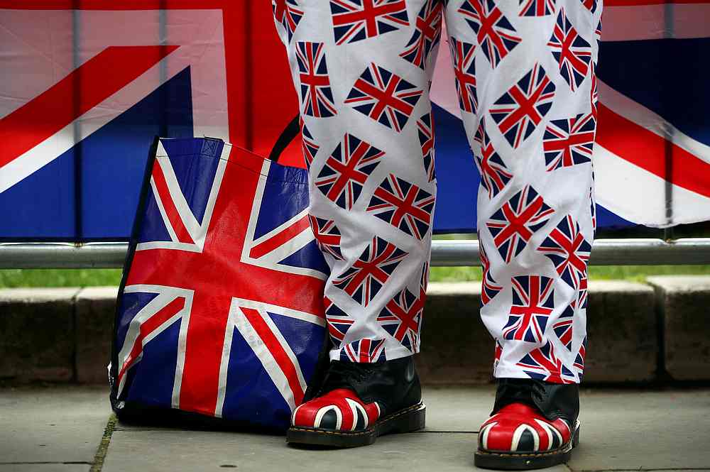 A pro-Brexit protester stands outside the Houses of Parliament in London March 13, 2019. u00e2u20acu201d Reuters pic 