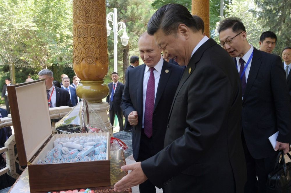Russian President Vladimir Putin and Chinese President Xi Jinping look at ice creams before the fifth regular foreign ministersu00e2u20acu2122 meeting of the Conference on Interaction and Confidence Building Measures in Asia in Dushanbe on June 15, 2019. u00e2u20acu201d AFP pic