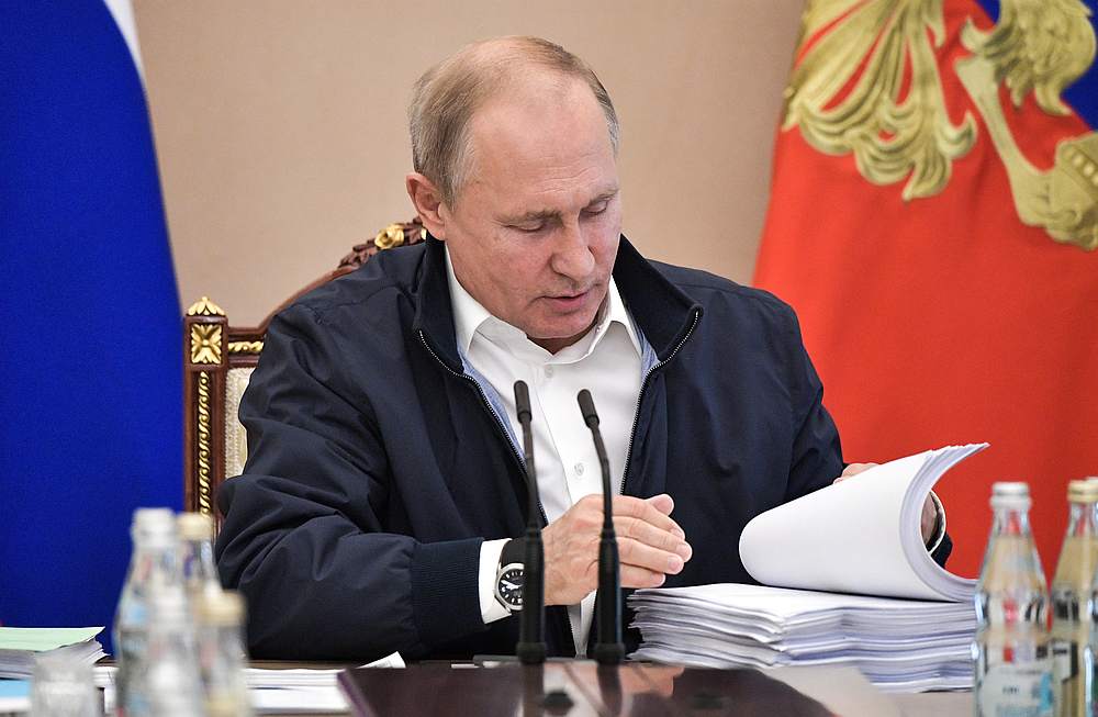 Russian President Vladimir Putin turns over papers during a meeting, dedicated to his upcoming televised phone-in with citizens, in Moscow June 19, 2019. u00e2u20acu201d Sputnik/Alexei Nikolsky/Kremlin pic via Reuters