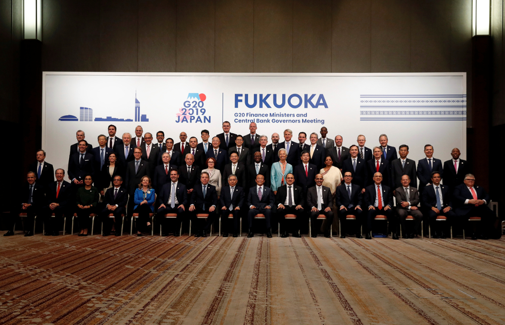 Japanu00e2u20acu2122s Finance Minister Taro Aso poses with delegations members for a family photo during the G20 Finance Ministers and Central Bank Governors Meeting in Fukuoka June 9, 2019. u00e2u20acu201d Reuters pic