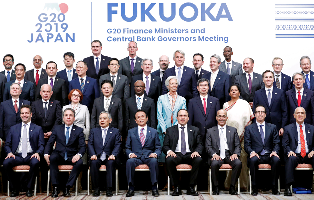 Japanu00e2u20acu2122s Finance Minister Taro Aso poses with delegations members for a family photo during the G20 Finance Ministers and Central Bank Governors Meeting in Fukuoka June 9, 2019. u00e2u20acu201d Reuters pic