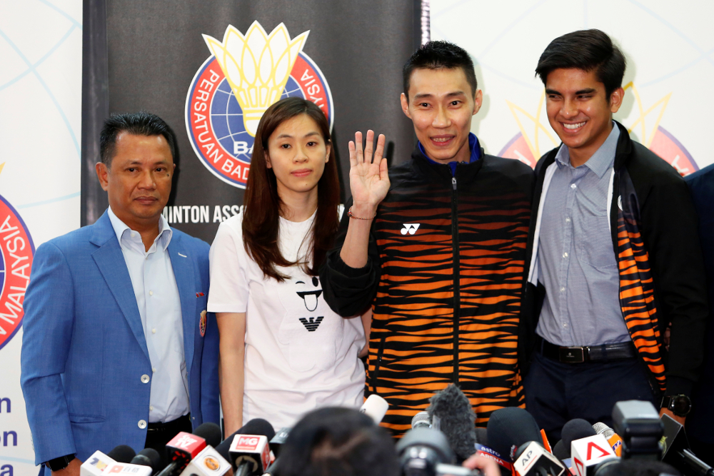 Datuk Lee Chong Wei, poses with his wife Wong Mew Choo, BAM President Datuk Seri Norza Zakaria and Minister of Youth and Sports Syed Saddiq Syed Abdul Rahman after a news conference to announce his retirement in Putrajaya June 13, 2019. u00e2u20acu201d Reuters pic
