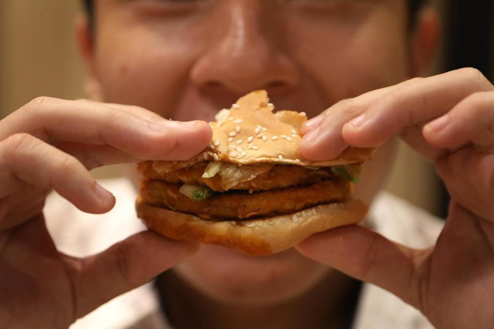 Close-up of a burger being eaten. u00e2u20acu201d TODAY pic