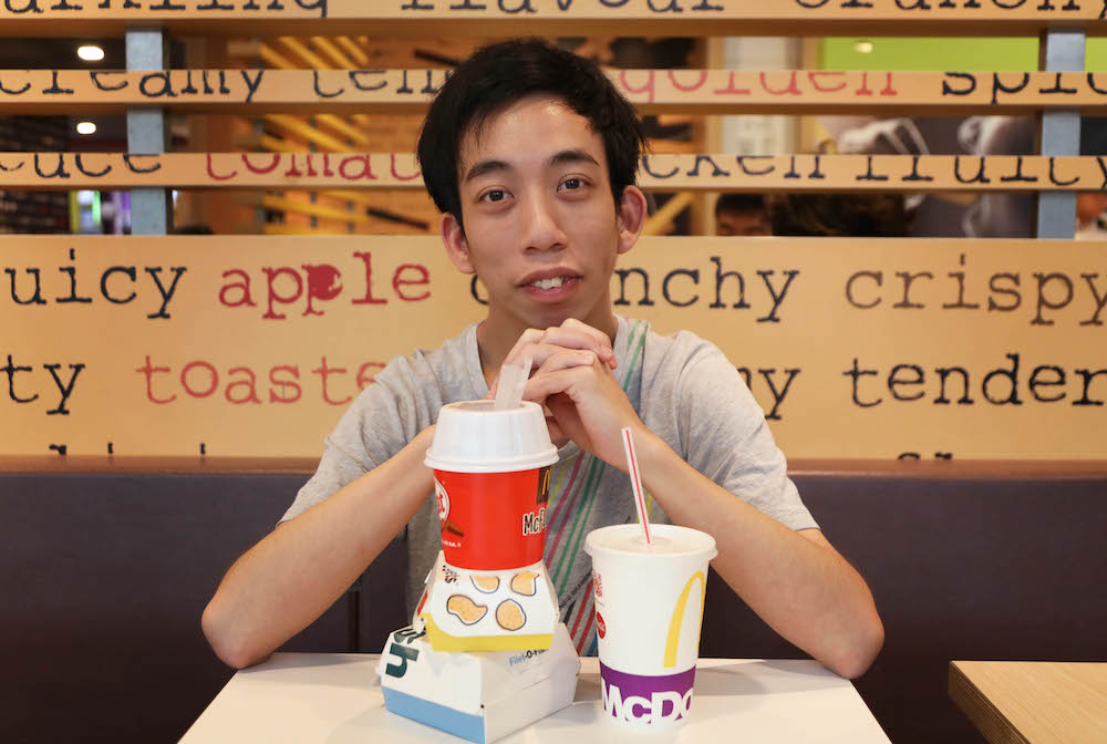 Watt Zhong Qing indulges in fast food about four times a week. He was one of the first in line when American burger joint Shake Shack opened its doors in Singapore in April. — TODAY pic
