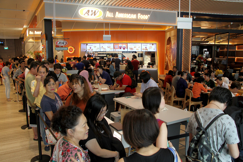 A long queue was seen outside A&W when it opened in Jewel Changi Airport in April. — TODAY pic