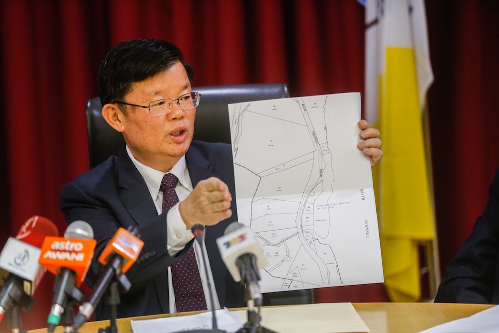 Penang Chief Minister Chow Kon Yeow shows the sitemap of the landslide in Tanjung Bungah during a press conference in George Town June 26, 2019. u00e2u20acu201d Picture by Sayuti Zainudin