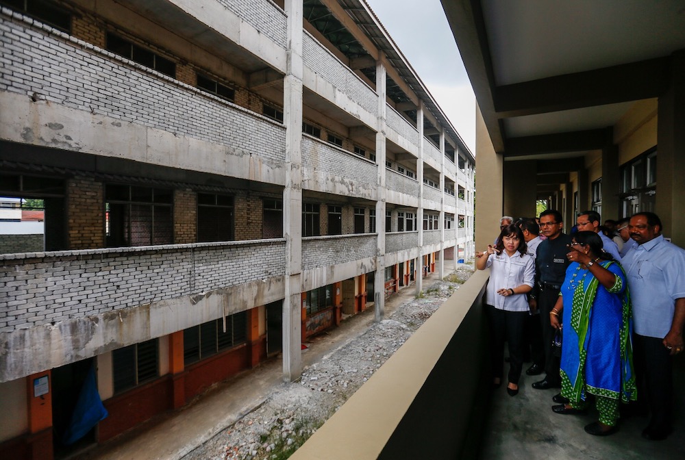 Headmistress V. Tamilselvi (middle) speaks to Deputy Education Minister Teo Nie Ching during her working visit at SJK (T) Permatang Tinggi in Nibong Tebal June 25, 2019. u00e2u20acu201d Picture by Sayuti Zainudin