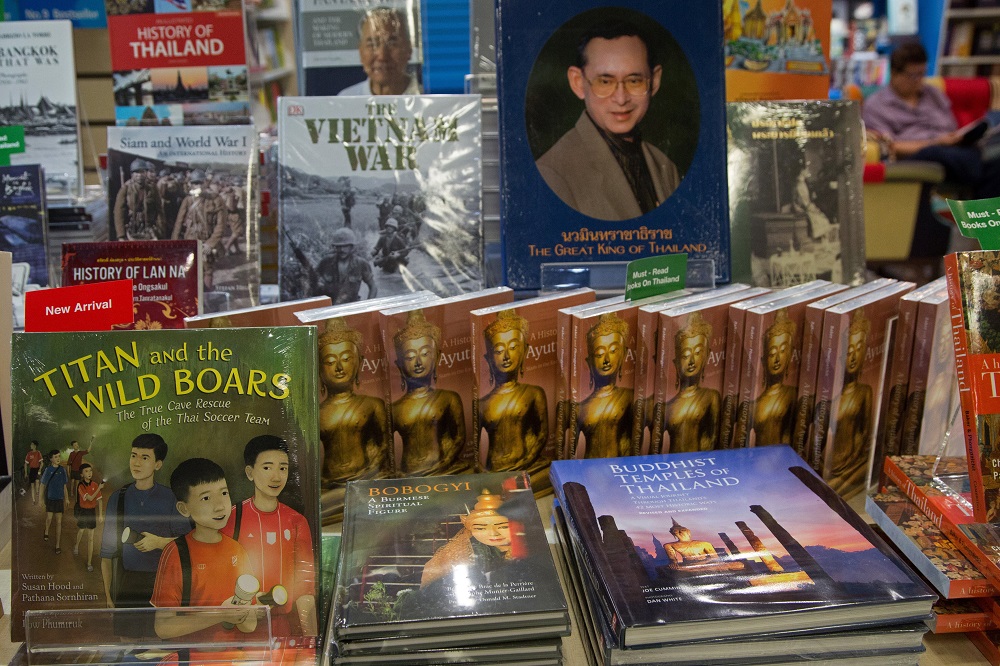 This picture taken on June 17, 2019 shows books at a bookstore in Bangkok relating to the rescue of the 12 boys from the u00e2u20acu02dcWild Boarsu00e2u20acu2122 football team and their coach from the Tham Luang cave in the Mae Sai last year. u00e2u20acu201d AFP pic       