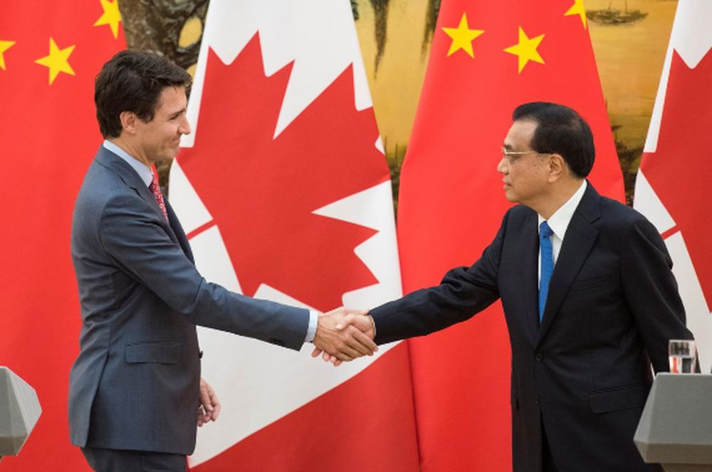 Canadian Prime Minister Justin Trudeau and Chinese Premier Li Keqiang shake hands during a news conference meeting at the Great Hall of the People in Beijing, December 4, 2017. u00e2u20acu201d Reuters pic