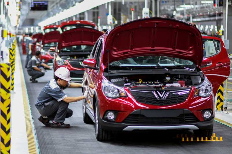 Workers operate the car assembly line at the new automobile plant of VinFast, Vietnam's first homegrown car manufacturer in Haiphong. u00e2u20acu2022 AFP pic