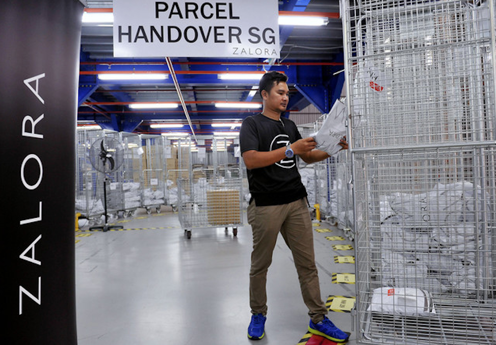 A worker prepares parcels for delivery at Zalorau00e2u20acu2122s regional distribution centre in Shah Alam March 3, 2019. u00e2u20acu201d Bernama pic