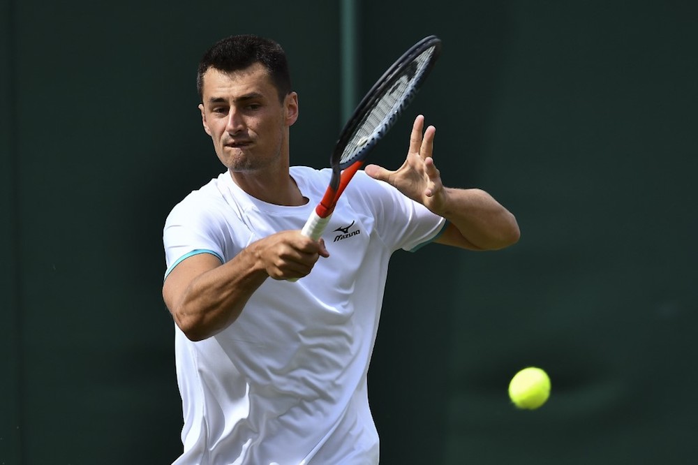 Australiau00e2u20acu2122s Bernard Tomic returns against Franceu00e2u20acu2122s Jo-Wilfried Tsonga during their menu00e2u20acu2122s singles first-round match at Wimbledon in London July 2, 2019. u00e2u20acu201d AFP pic