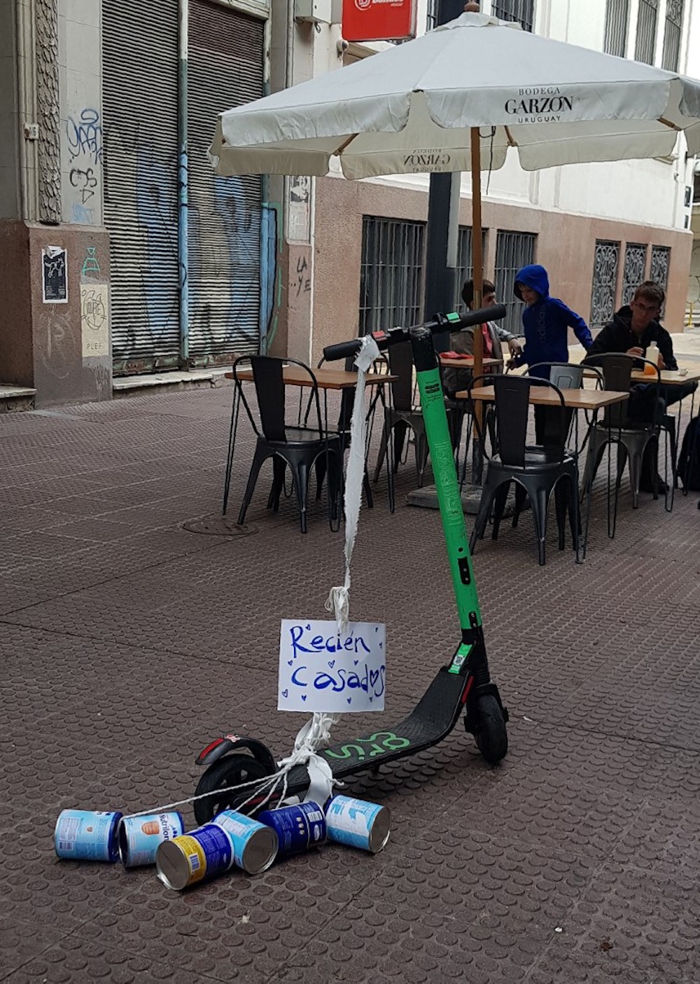 A rented electric scooter reading ‘Just married’ remains parked on a street in Montevideo May 8, 2019. — AFP pic