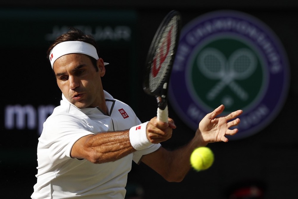 Switzerlandu00e2u20acu2122s Roger Federer returns against Spainu00e2u20acu2122s Rafael Nadal during their menu00e2u20acu2122s singles semi-final match at the 2019 Wimbledon Championships in London July 12, 2019. u00e2u20acu201d AFP pic