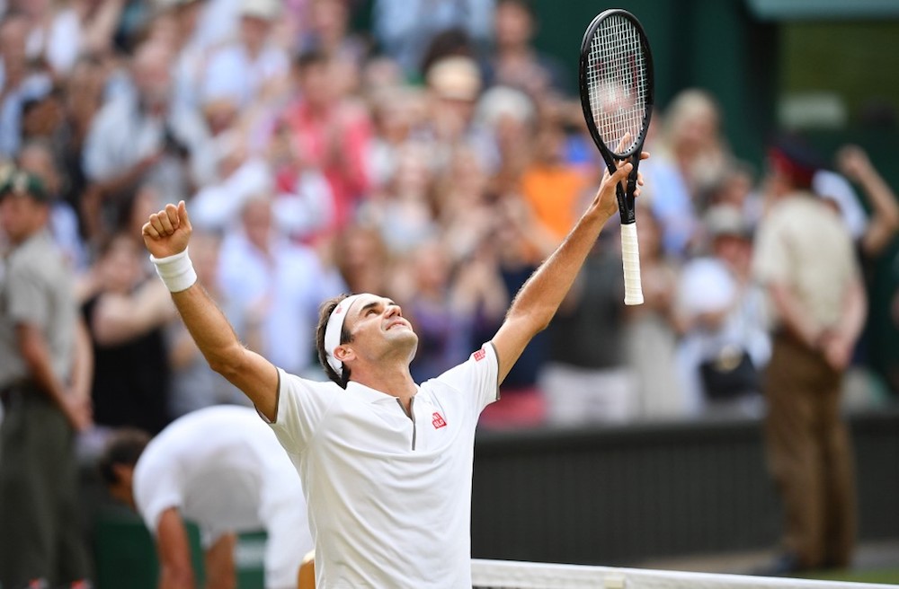 Switzerland’s Roger Federer celebrates after beating Spain’s Rafael Nadal in their men’s singles semi-final match at the 2019 Wimbledon Championships in London July 12, 2019. — AFP pic