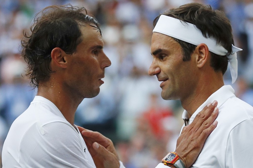 Switzerlandu00e2u20acu2122s Roger Federer shakes hands with Spainu00e2u20acu2122s Rafael Nadal after their menu00e2u20acu2122s singles semi-final match at the 2019 Wimbledon Championships in London July 12, 2019. u00e2u20acu201d AFP pic