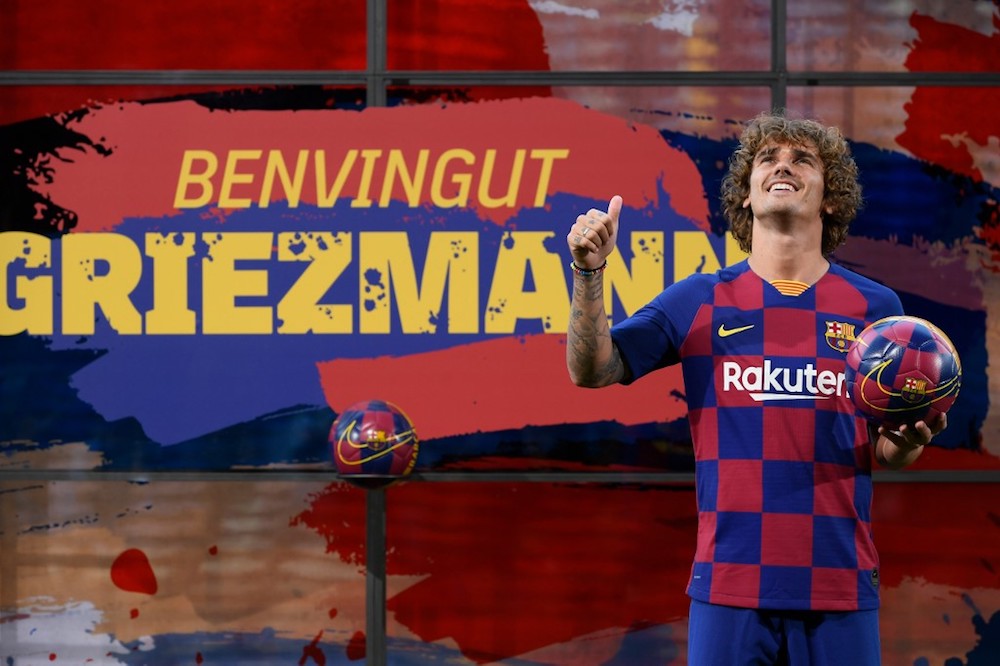 Barcelonau00e2u20acu2122s new forward Antoine Griezmann poses with his jersey during his official presentation by the Spanish football club at the Camp Nou stadium in Barcelona July 14, 2019. u00e2u20acu201d AFP pic