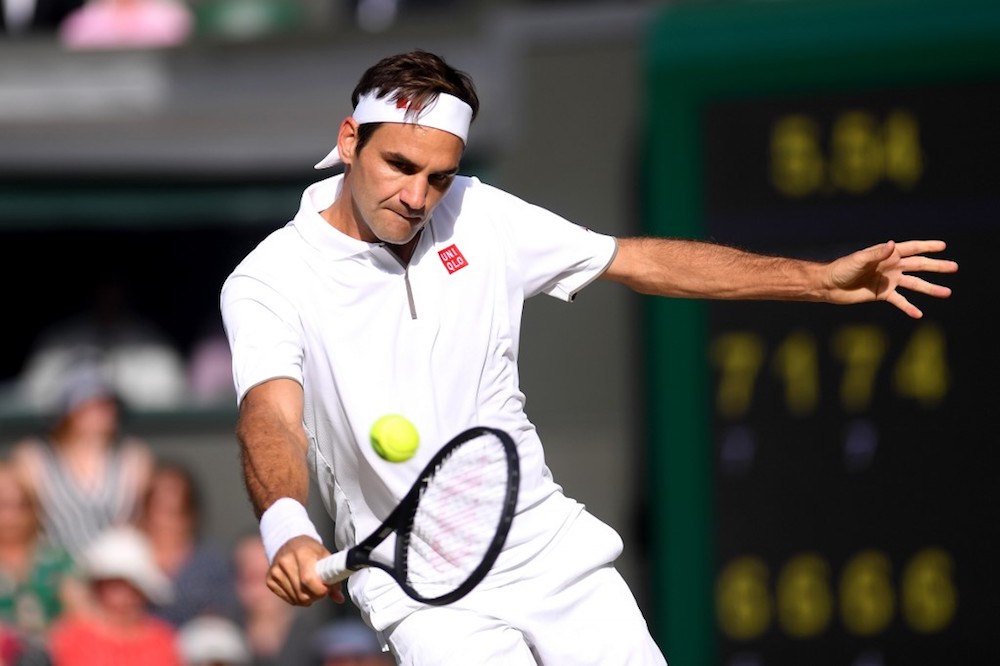 Switzerlandu00e2u20acu2122s Roger Federer returns against Serbiau00e2u20acu2122s Novak Djokovic during their menu00e2u20acu2122s singles final at the 2019 Wimbledon Championships in London July 14, 2019. u00e2u20acu201d AFP pic