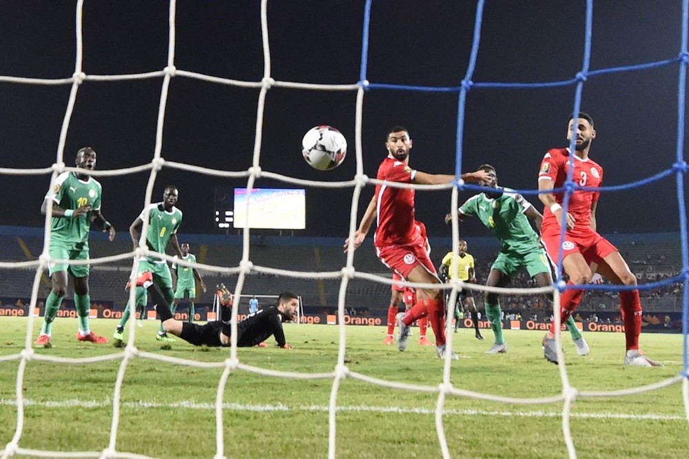 Tunisiau00e2u20acu2122s defender Dylan Bronn scores an own goal during the 2019 Africa Cup of Nations (CAN) semi-final match with Senegal at the 30 June stadium in Cairo July 14, 2019. u00e2u20acu201d AFP pic