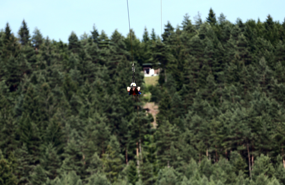 A woman rides on a zip line in village Rudopolje, Croatia July 5, 2019. u00e2u20acu201d Reuters pic
