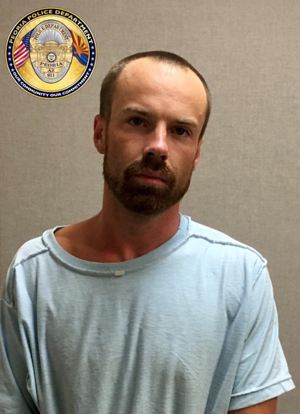 This unlocated handout photo released by the Peoria Police Department on July 4, 2019 shows 27-year-old Michael Adams. u00e2u20acu201d Peoria Police Department handout via AFP