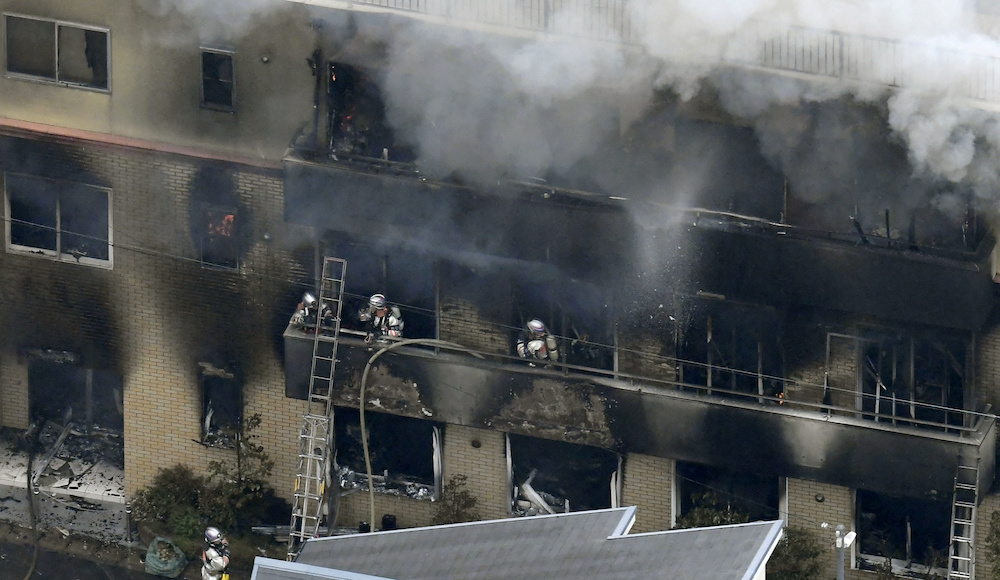 An aerial view shows firefighters battling the fires at the site where a man started a fire after spraying a liquid, at a three-storey studio of Kyoto Animation Co in Kyoto July 18, 2019. u00e2u20acu201d Kyodo handout via Reuters
