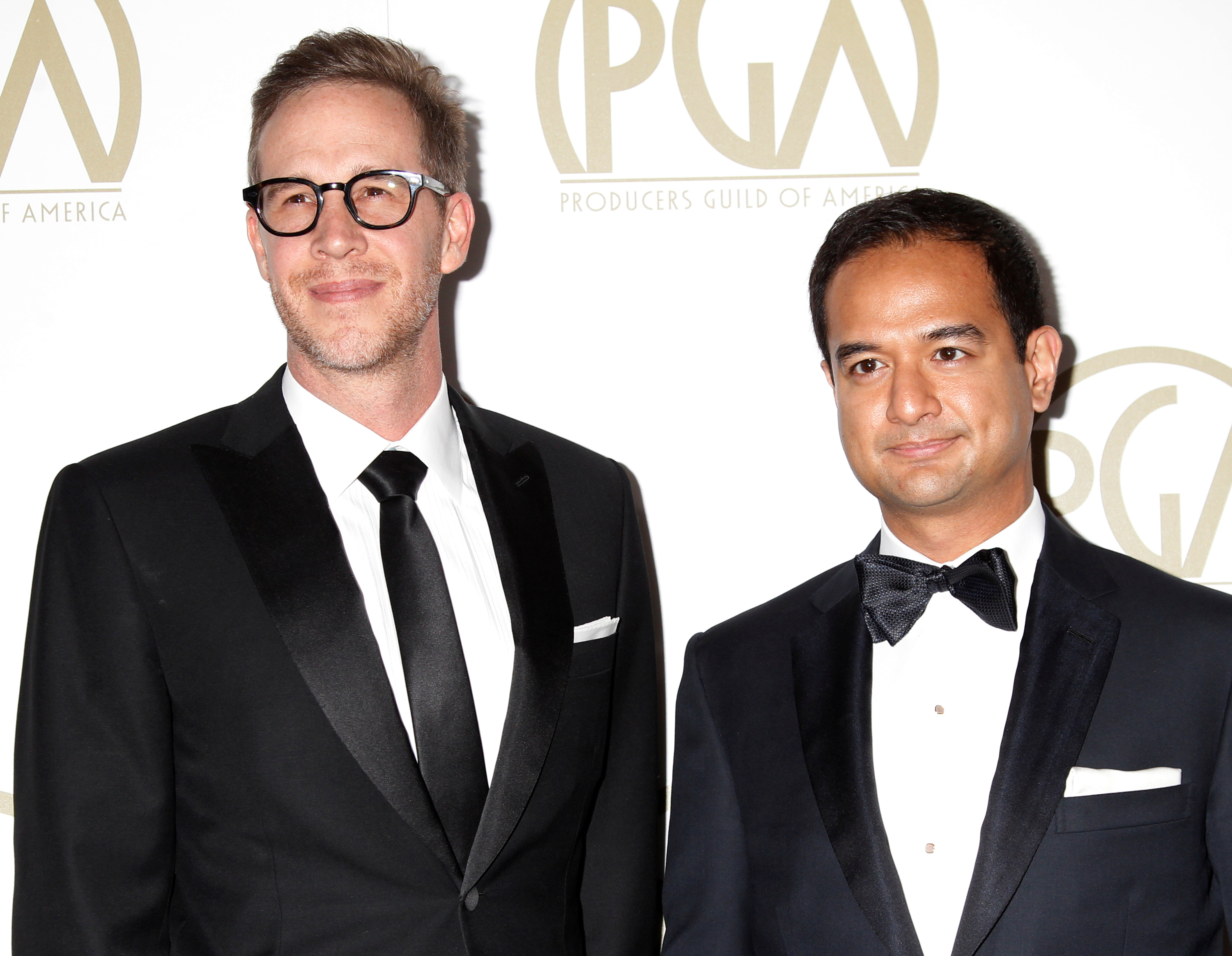Riza Aziz stands with Joey McFarland, another producer of the film u00e2u20acu02dcThe Wolf of Wall Streetu00e2u20acu2122, as they arrive at the 25th Annual Producers Guild of America Awards in Los Angeles January 19, 2014. u00e2u20acu201d Reuters pic