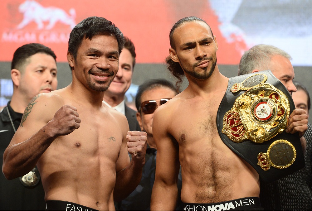 Manny Pacquiao (left) and Keith Thurman pose after weighing in for their WBA welterweight world title boxing fight in Las Vegas July 19, 2019. u00e2u20acu201d Picture by Joe Camporeale-USA TODAY Sports via Reuters