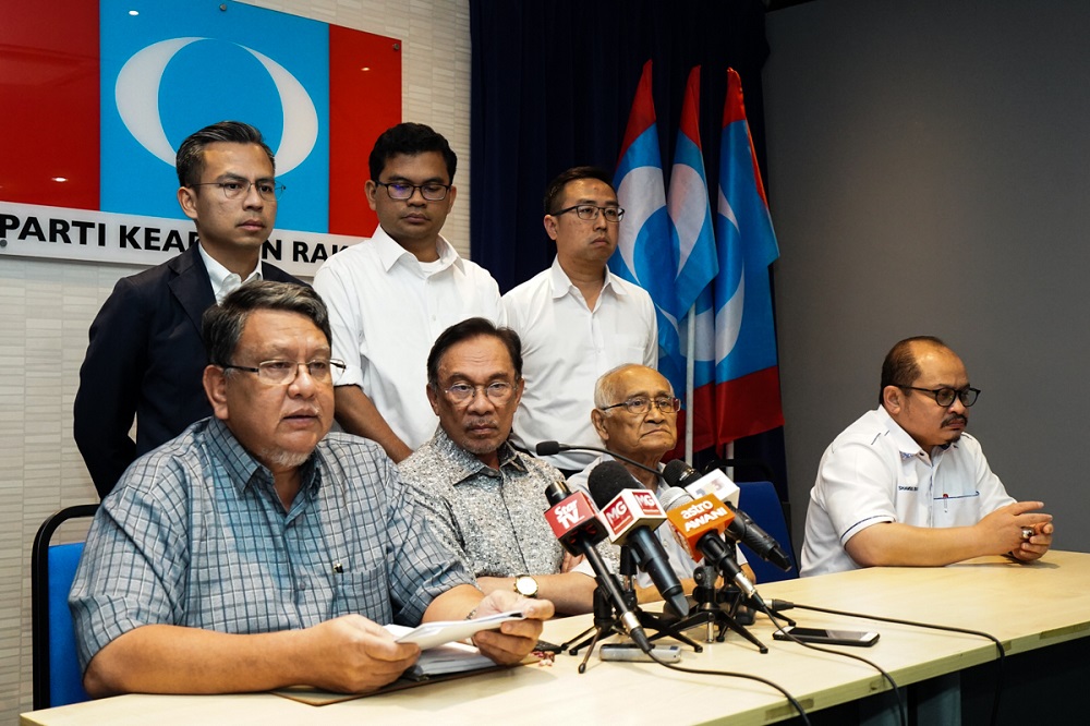 PKR Disciplinary Board chief Datuk Ahmad Kassim (seated, left) speaks during a press conference at the party headquarters in Petaling Jaya June 23, 2019. u00e2u20acu201d Picture by Ahmad Zamzahuri