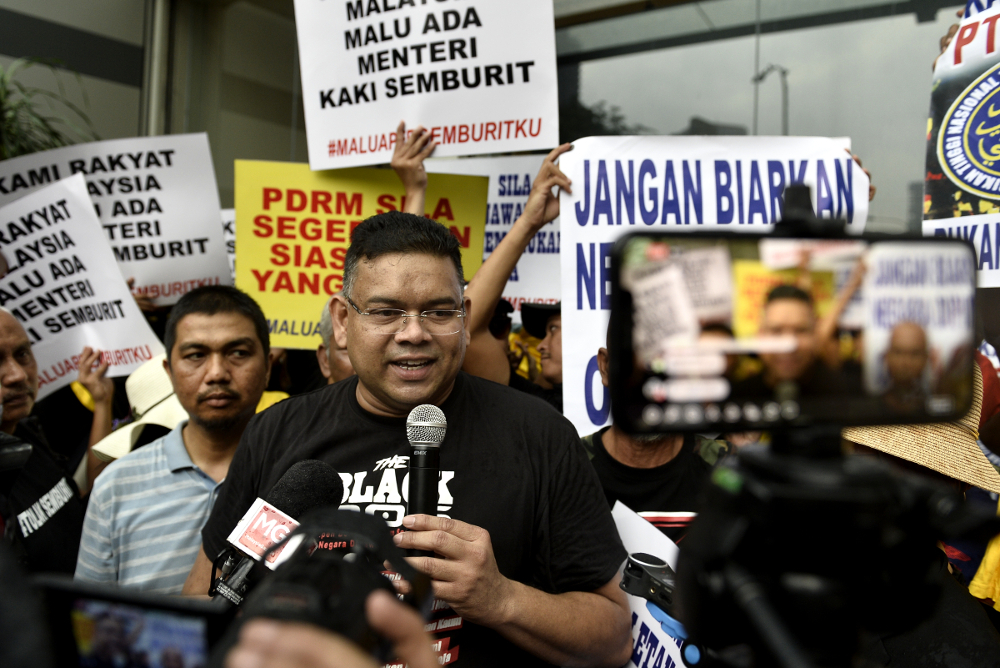 Datuk Lokman Adam speaks during a demonstration demanding the resignation of Datuk Seri Azmin Ali from his position as a cabinet minister in Kuala Lumpur July 6, 2019. u00e2u20acu201d Picture by Miera Zulyana