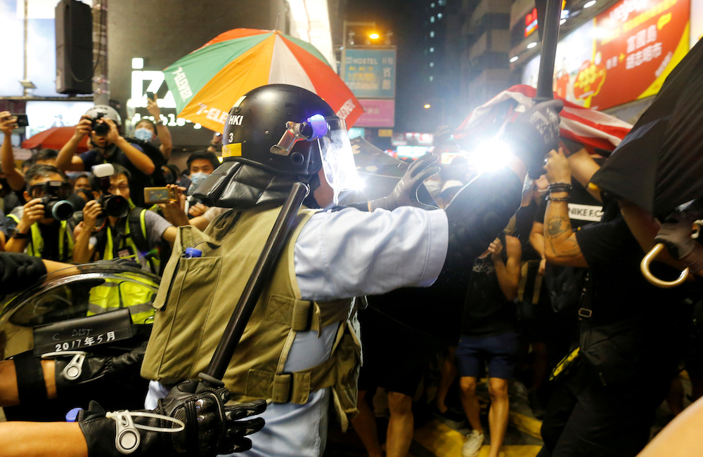 Riot police officers try to disperse anti-extradition bill protesters during a demonstration in Mong Kok area in Hong Kong July 7, 2019. u00e2u20acu201d Reuters picnn