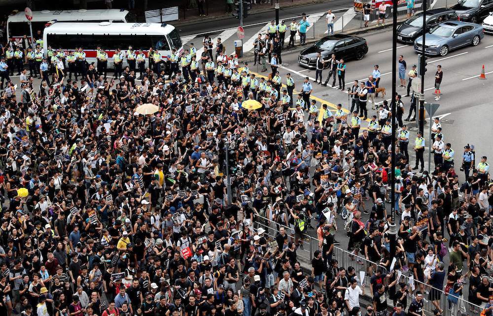 Anti-extradition bill protesters march to West Kowloon Express Rail Link Station at Hong Kong's tourism district Tsim Sha Tsui July 7, 2019. u00e2u20acu201d Reuters picnn