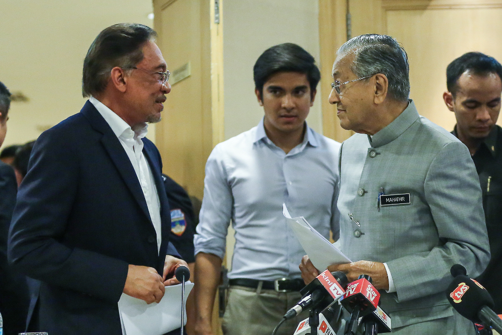 Prime Minister Tun Dr Mahathir Mohamad (right) and PKR president Datuk Seri Anwar Ibrahim after a press conference at Yayasan Kepimpinan Perdana in Putrajaya July 8, 2019. u00e2u20acu201d Picture by Yusof Mat Isa